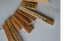 wind metal Jewellery in wood - hanger