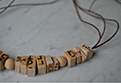brush Jewellery in wood-letter